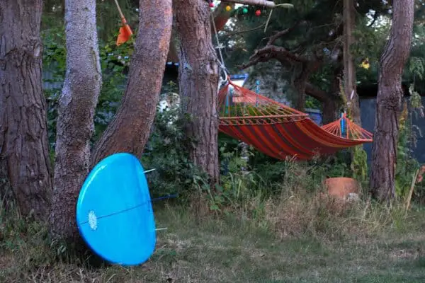 Blue Surfboard and Red Hammock