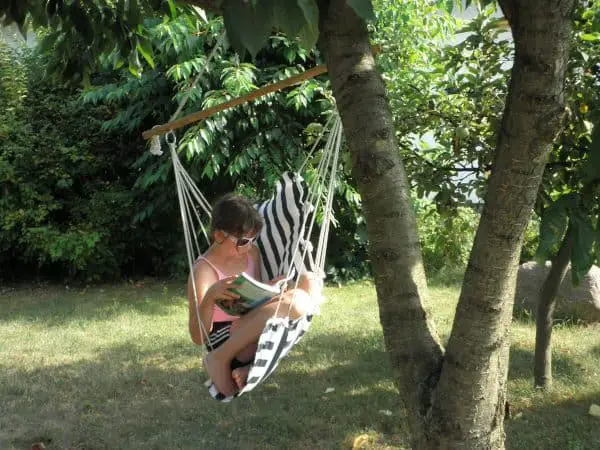 Child Reading on a Seat Swing