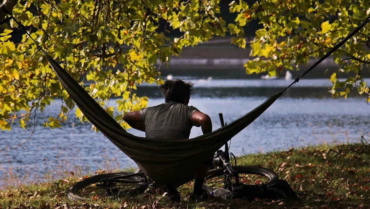 man getting into hammock